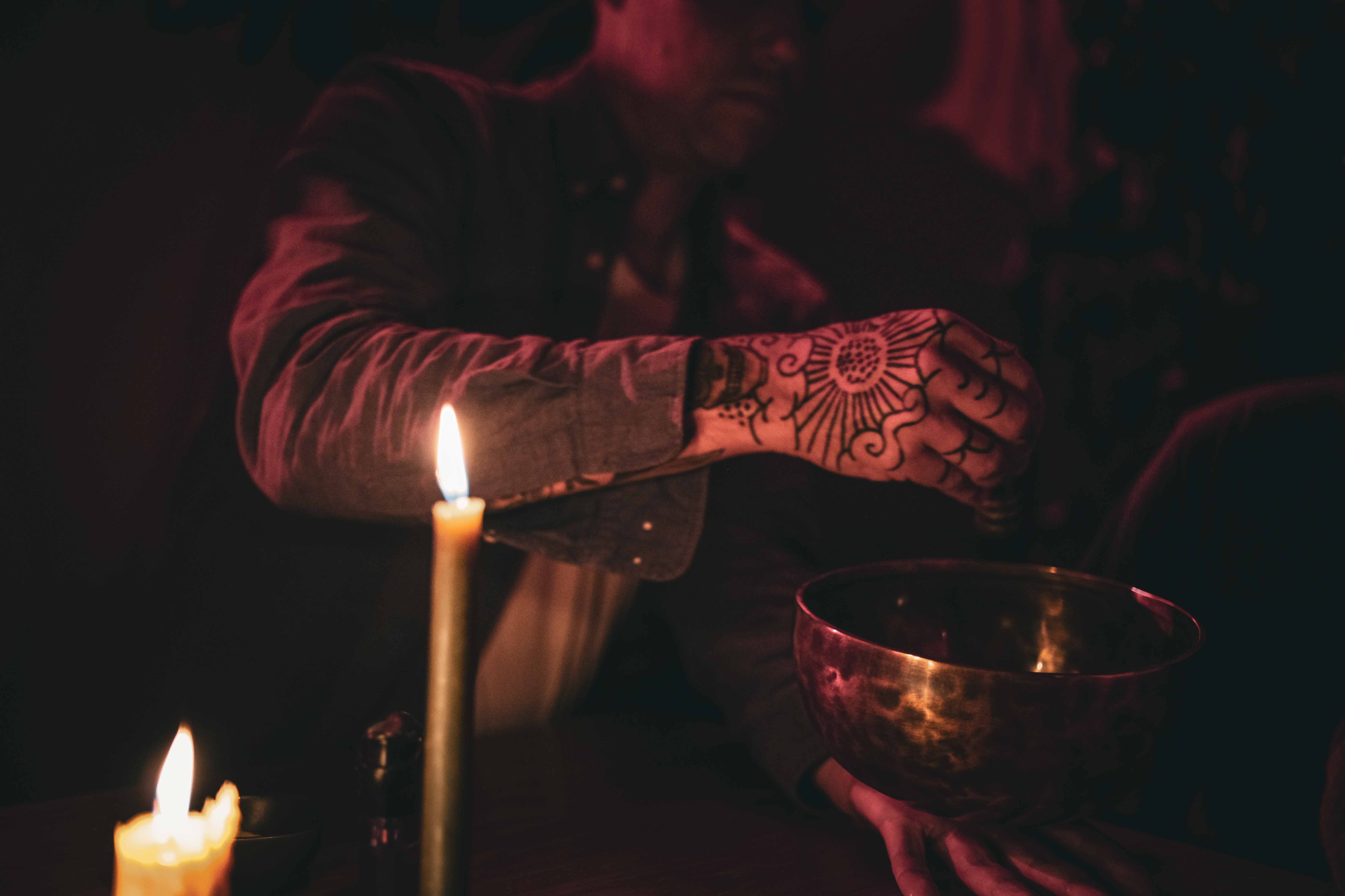 Sound therapy singing bowl by candlelight